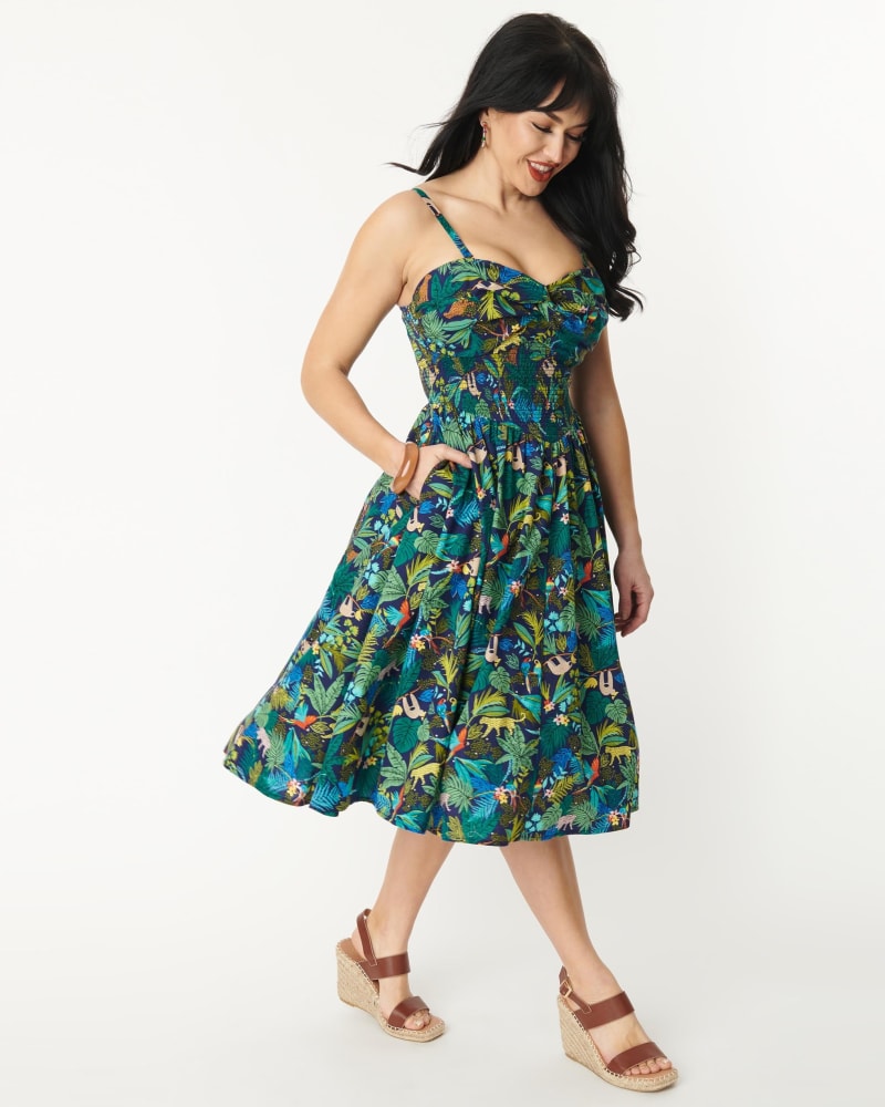 Front of a model wearing a size 2X Unique Vintage Navy Jungle Print Shimmy & Shake Swing Dress in Blue, Green, Floral by Unique Vintage. | dia_product_style_image_id:300911